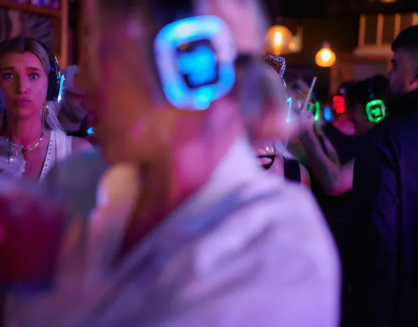 At the bar, everyone in their own headphones